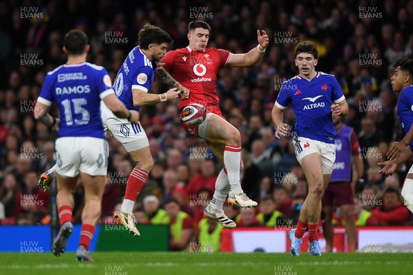 150226 - Wales v France - Guinness Men's Six Nations - Joe Hawkins of Wales is challenged by Matthieu Jalibert of France