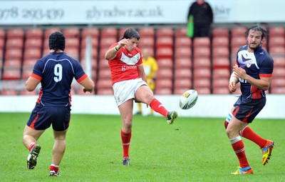 160612 - Wales v France  - Race Course Ground, Wrexham - Danny Jones of Wales, centre, kicks the ball downfield -