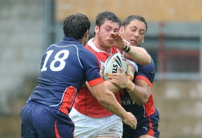 160612 - Wales v France  - Race Course Ground,  Wrexham - Ross Divorty of Wales is wrapped up by the France defence