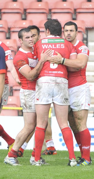 160612 - Wales v France  - Race Course Ground, Wrexham - Rhys Williams, right, is congratulated by team mates after scoring
