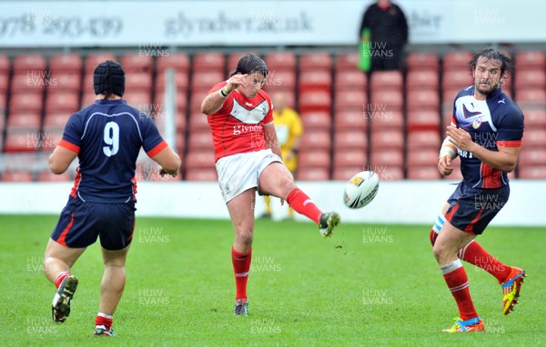 160612 - Wales v France  - Race Course Ground, Wrexham - Danny Jones of Wales, centre, kicks the ball downfield -
