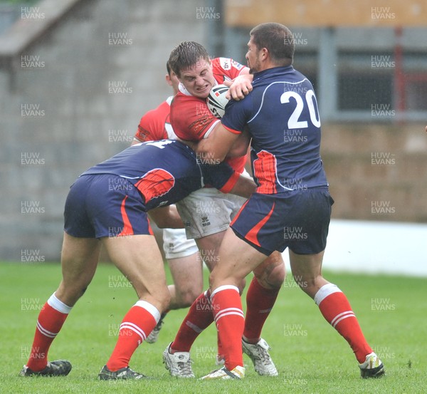 160612 - Wales v France  - Race Course Ground - WrexhamJacob Emmitt of Wales, centre , is tackled by Olivier Elima, left and Mickael Simonof France