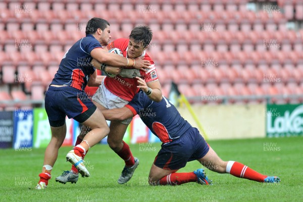 160612 - Wales v France  - Race Course Ground, Wrexham - Michael Channing of Wales, centre , is tackled by Mathias Pala, left and Antoni Maria of France