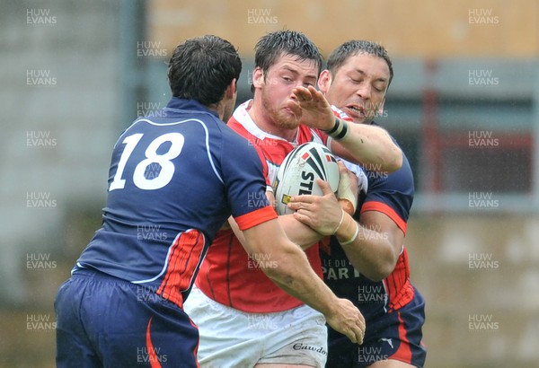 160612 - Wales v France  - Race Course Ground,  Wrexham - Ross Divorty of Wales is wrapped up by the France defence