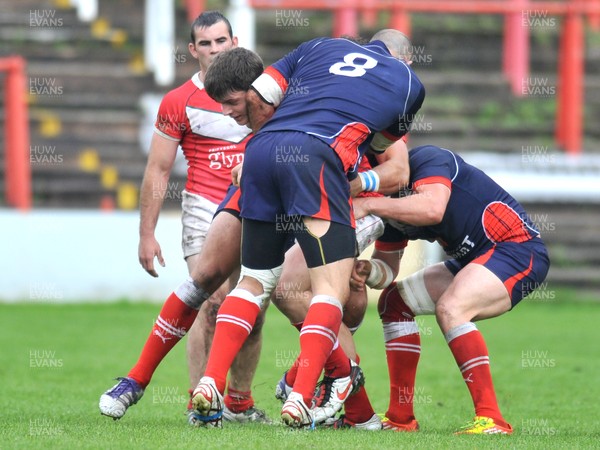 160612 - Wales v France  - Race Course Ground,  Wrexham - Rhodri Lloyd of Wales is tackled by of three French players