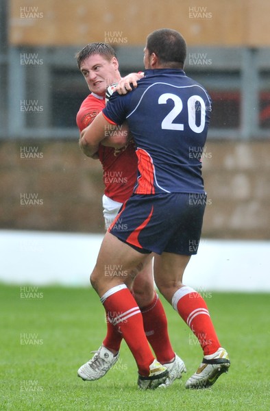 160612 - Wales v France  - Race Course Ground,  Wrexham - Jacob Emmitt of Wales, left, is tackled by Mickael Simon of France