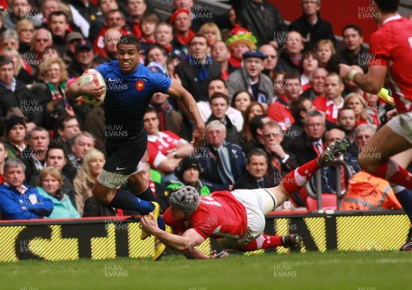 170312 Wales v France - RBS 6 Nations Championship - France's Wesley Fofana is tackled by Wales' Jonathan Davies  