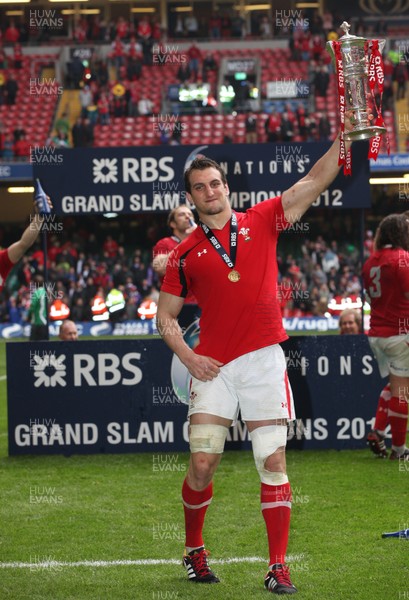 170312 -  Wales v France, RBS 6 Nations - Wales' Sam Warburton celebrates the Grand Slam with the Six Nations Trophy