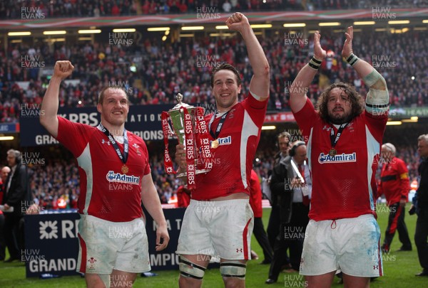 170312 -  Wales v France, RBS 6 Nations - Wales' Gethin Jenkins, Ryan Jones  and Adam Jones celebrate with the Six Nations trophy after the Grand Slam Win  