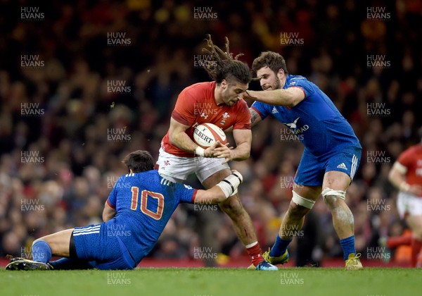 170318 - Wales v France - NatWest 6 Nations -  Josh Navidi of Wales is tackled by Francois Trinh-Duc and Marco Tauleigne of France 