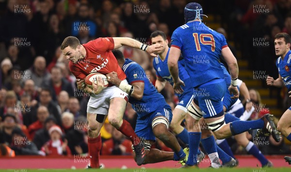 170318 - Wales v France - NatWest 6 Nations 2018 - George North of Wales is tackled by Mathieu Babillot of France