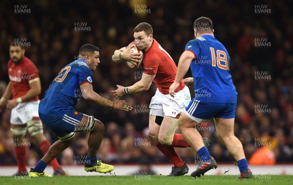 170318 - Wales v France - NatWest 6 Nations 2018 - George North of Wales is tackled by Mathieu Babillot and Rabah Slimani of France