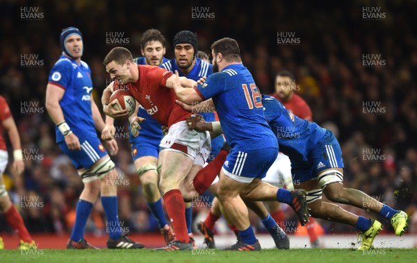 170318 - Wales v France - NatWest 6 Nations 2018 - George North of Wales is tackled by Mathieu Babillot and Rabah Slimani of France
