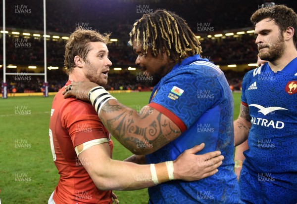 170318 - Wales v France - NatWest 6 Nations 2018 - Leigh Halfpenny of Wales and Mathieu Bastareaud of France at the end of the game