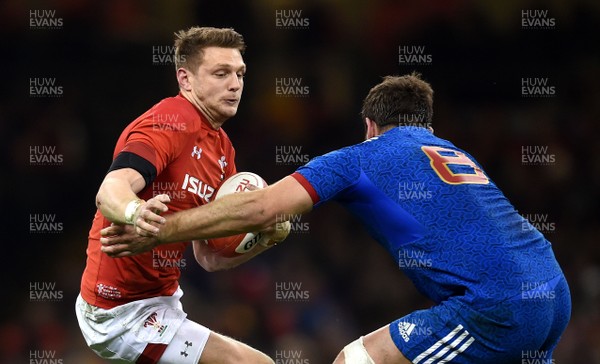 170318 - Wales v France - NatWest 6 Nations 2018 - Dan Biggar of Wales takes on Marco Tauleigne of France