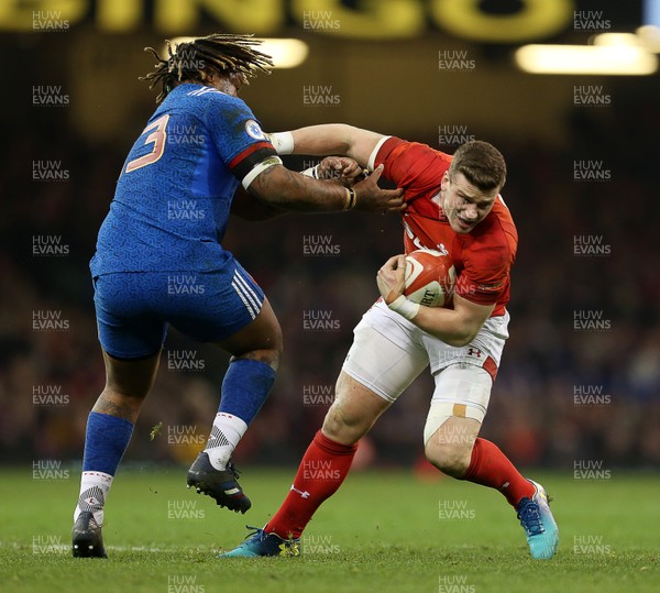 170318 - Wales v France - Natwest 6 Nations Championship - Scott Williams of Wales is tackled by Mathieu Bastareaud of France