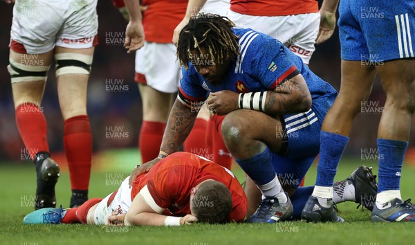 170318 - Wales v France - Natwest 6 Nations Championship - Mathieu Bastareaud of France checks if Scott Williams of Wales okay after receiving a knock to the head