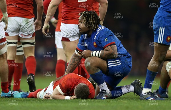 170318 - Wales v France - Natwest 6 Nations Championship - Mathieu Bastareaud of France checks if Scott Williams of Wales okay after receiving a knock to the head