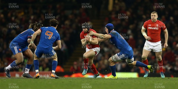 170318 - Wales v France - Natwest 6 Nations Championship - Leigh Halfpenny of Wales is tackled by Wenceslas Lauret of France