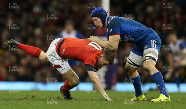 170318 - Wales v France - Natwest 6 Nations Championship - Dan Biggar of Wales is dragged down by Wenceslas Lauret of France
