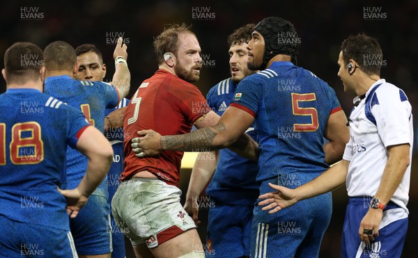170318 - Wales v France - Natwest 6 Nations Championship - Alun Wyn Jones of Wales is helped up by Sebastien Vahaamahina of France