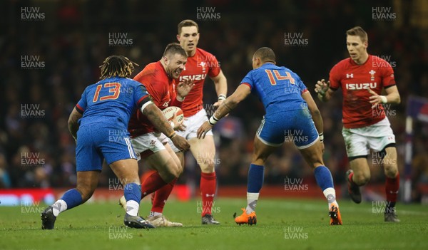 170318 - Wales v France, NatWest 6 Nations 2018 - Rob Evans of Wales is tackled by Mathieu Bastareaud of France and Gael Fickou of France