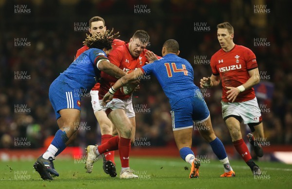 170318 - Wales v France, NatWest 6 Nations 2018 - Rob Evans of Wales is tackled by Mathieu Bastareaud of France and Gael Fickou of France