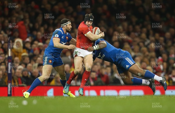 170318 - Wales v France, NatWest 6 Nations 2018 - Leigh Halfpenny of Wales is tackled