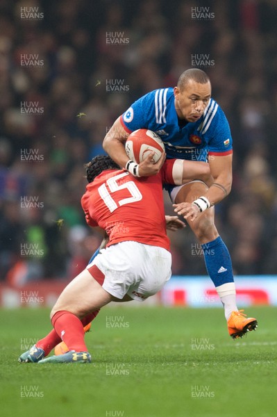 170318 - Wales v France - NatWest 6 Nations Championship - Gael Fickou of France is tackled by Leigh Halfpenny of Wales 