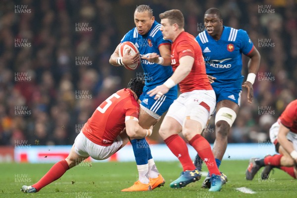 170318 - Wales v France - NatWest 6 Nations Championship - Gael Fickou of France is tackled by Leigh Halfpenny of Wales and Scott Williams of Wales 
