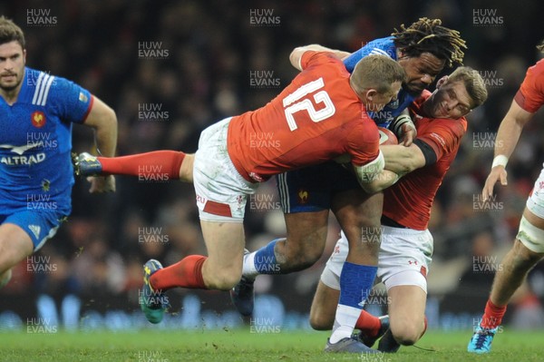 170318 - Wales v France - NatWest 6 Nations Championship - Mathieu Bastareaud of France is tackled by Hadleigh Parkes of Wales and Dan Biggar of Wales 