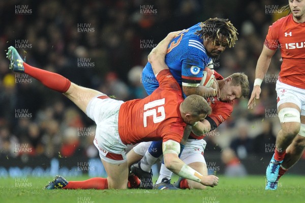 170318 - Wales v France - NatWest 6 Nations Championship - Mathieu Bastareaud of France is tackled by Hadleigh Parkes of Wales and Dan Biggar of Wales 
