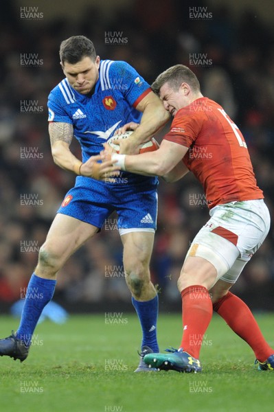170318 - Wales v France - NatWest 6 Nations Championship - Remy Grosso of France is tackled by Scott Williams of Wales 
