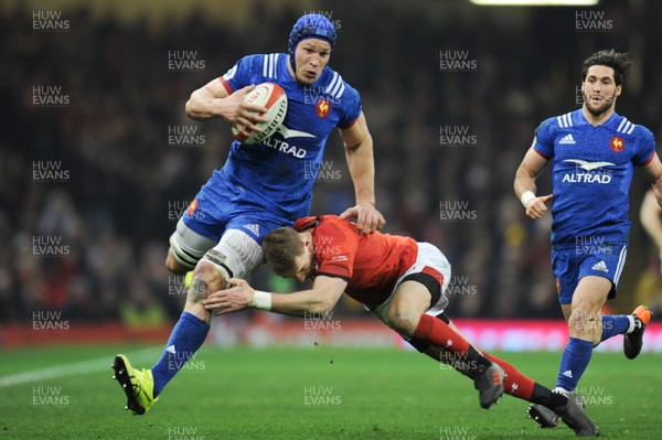 170318 - Wales v France - NatWest 6 Nations Championship - Wenceslas Lauret of France is tackled by Liam Williams of Wales 