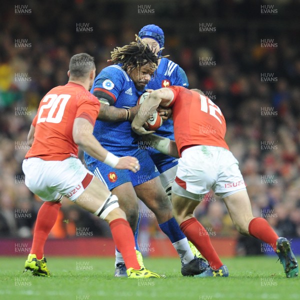 170318 - Wales v France - NatWest 6 Nations Championship - Mathieu Bastareaud of France is tackled by Hadleigh Parkes of Wales 