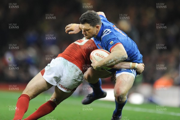 170318 - Wales v France - NatWest 6 Nations Championship - Remy Grosso of France is tackled by Leigh Halfpenny of Wales 