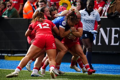 180426 - Wales v France - Guinness Women's Six Nations - Lea Murie of France is tackled by Courtney Keight of Wales and Seren Singleton of Wales
