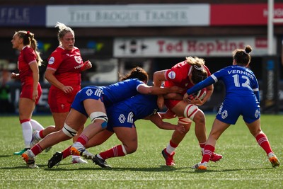 180426 - Wales v France - Guinness Women's Six Nations - Natalia John of Wales is tackled by Manae Feleu, Mathilde Lazarko and Gabrielle Vernier of France