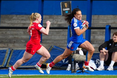 180426 - Wales v France - Guinness Women's Six Nations - Lea Murie of France runs with the ball whilst under pressure from Seren Lockwood of Wales