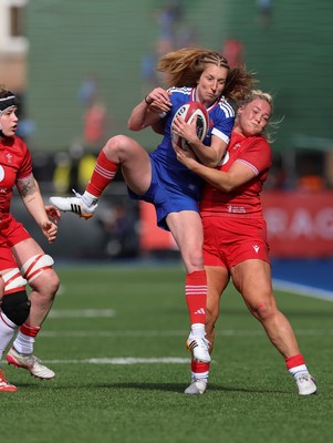 180426 - Wales v France, Guinness Women’s 6 Nations - Pauline Bourdon Sansus of France is held by Kelsey Jones of Wales