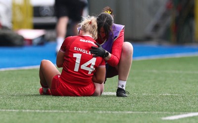 180426 - Wales v France, Guinness Women’s 6 Nations - Seren Singleton of Wales is checked by Gwen Williams, team doctor