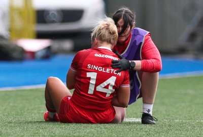 180426 - Wales v France, Guinness Women’s 6 Nations - Seren Singleton of Wales is checked by Gwen Williams, team doctor