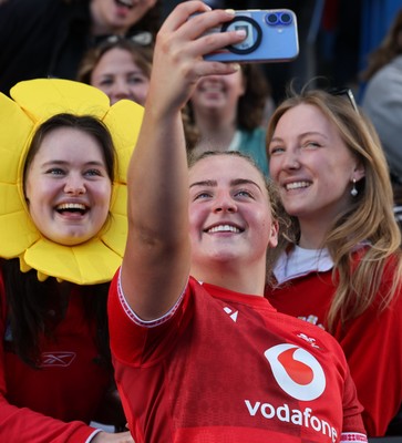 180426 - Wales v France, Guinness Women’s 6 Nations - Molly Reardon of Wales with supporters at the end of the match 