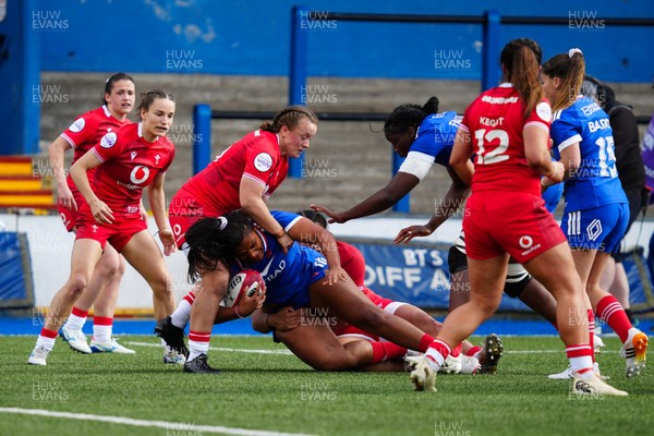 180426 - Wales v France - Guinness Women's Six Nations - Ambre Mwayembe of France is tackled by Lleucu George of Wales