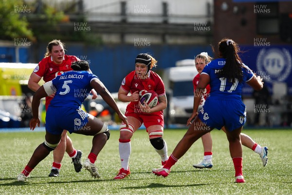 180426 - Wales v France - Guinness Women's Six Nations - Bethan Lewis of Wales is tackled by Madoussou Fall of France