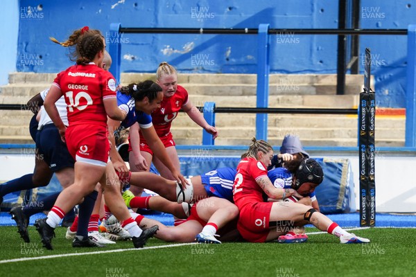 180426 - Wales v France - Guinness Women's Six Nations - Keira Bevan of Wales stops Siobhan Soqeta of France from scoring a try