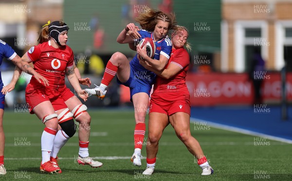 180426 - Wales v France, Guinness Women’s 6 Nations - Pauline Bourdon Sansus of France is held by Kelsey Jones of Wales