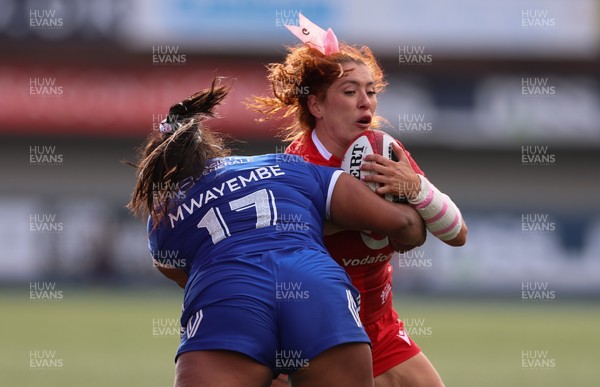 180426 - Wales v France, Guinness Women’s 6 Nations - Georgia Evans of Wales takes on Ambre Mwayembe of France