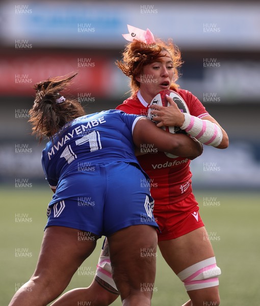 180426 - Wales v France, Guinness Women’s 6 Nations - Georgia Evans of Wales takes on Ambre Mwayembe of France