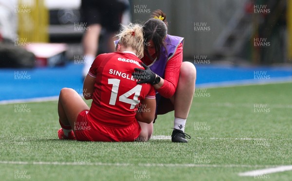180426 - Wales v France, Guinness Women’s 6 Nations - Seren Singleton of Wales is checked by Gwen Williams, team doctor